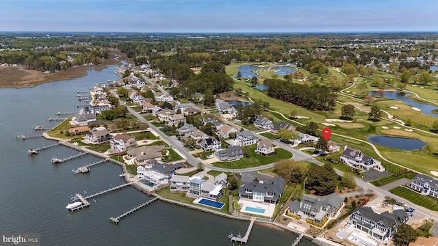 128 W Side Dr, Rehoboth Beach, DE 19971 - aerial view of property and surrounding area featuring a nearby body of water, a golf course, and nearby suburban area