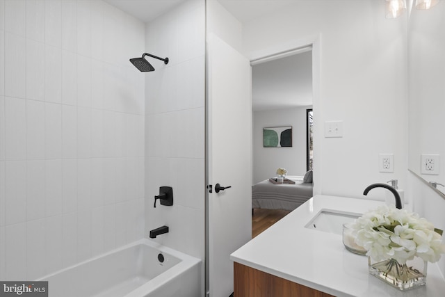ensuite bathroom with shower / bath combination, vanity, and connected bathroom