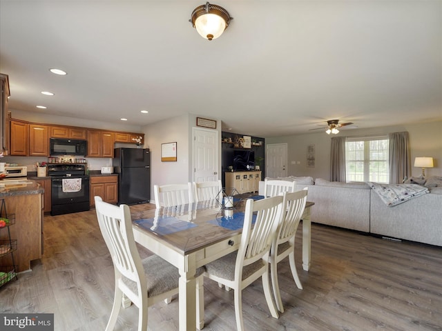 dining space featuring a toaster, ceiling fan, wood finished floors, and recessed lighting