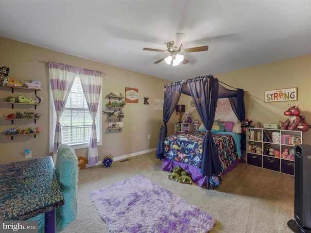 bedroom with visible vents, carpet flooring, baseboards, and a ceiling fan