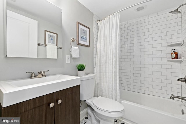 bathroom featuring shower / bath combo with shower curtain, toilet, and vanity