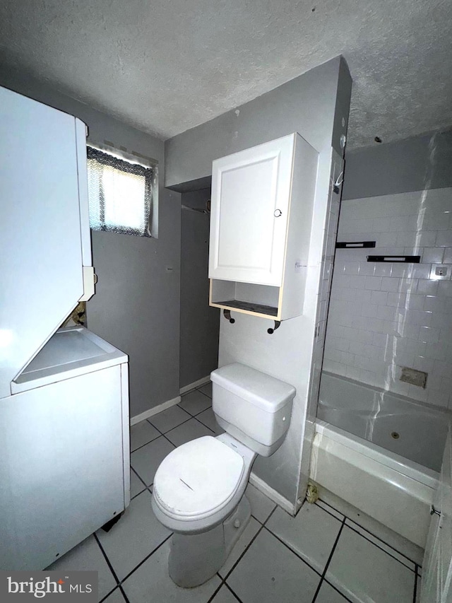 7437 Berkshire Rd, Baltimore, MD 21224 - full bathroom with toilet, bathtub / shower combination, a textured ceiling, tile patterned floors, and baseboards