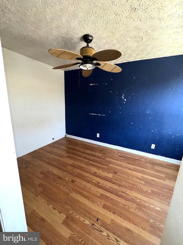 7437 Berkshire Rd, Baltimore, MD 21224 - empty room with wood finished floors, ceiling fan, baseboards, and a textured ceiling
