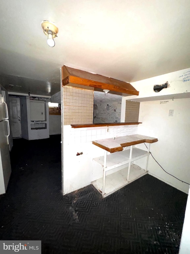 7437 Berkshire Rd, Baltimore, MD 21224 - basement featuring freestanding refrigerator