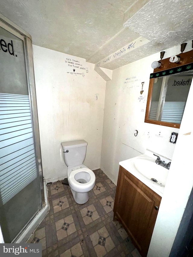 7437 Berkshire Rd, Baltimore, MD 21224 - full bathroom with vanity, tile patterned floors, toilet, and a stall shower