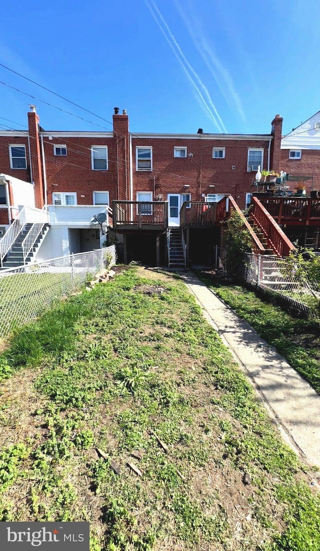 7437 Berkshire Rd, Baltimore, MD 21224 - rear view of house featuring stairway and a wooden deck