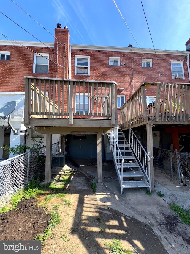 7437 Berkshire Rd, Baltimore, MD 21224 - back of house with a deck, stairway, and brick siding