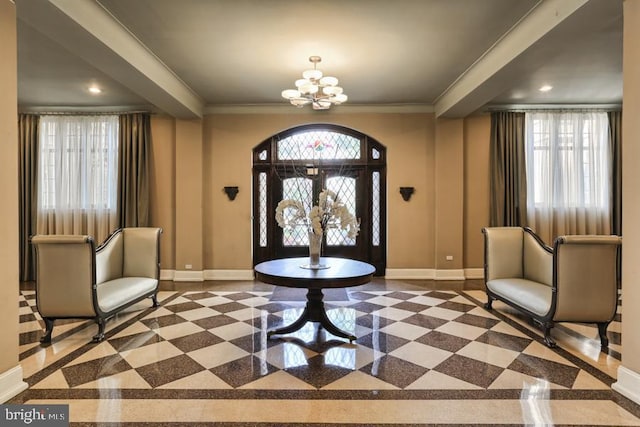 foyer entrance with baseboards, crown molding, an inviting chandelier, and recessed lighting