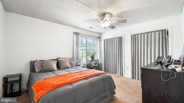 3801 Swann Rd Unit 101, Suitland, MD 20746 - bedroom featuring carpet, a textured ceiling, and a ceiling fan