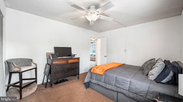 3801 Swann Rd Unit 101, Suitland, MD 20746 - carpeted bedroom featuring a textured ceiling and ceiling fan