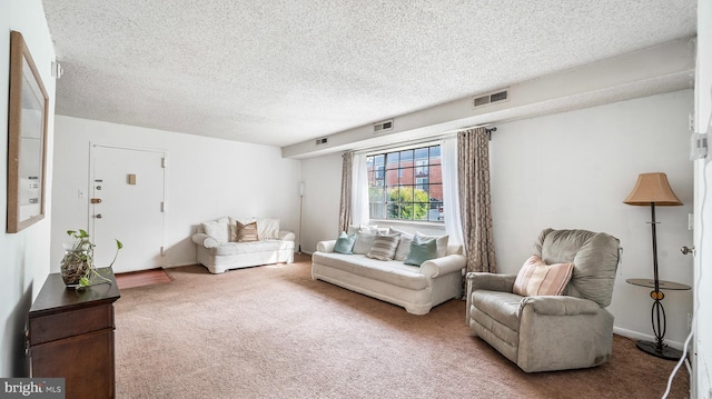 3801 Swann Rd Unit 101, Suitland, MD 20746 - carpeted living room featuring a textured ceiling