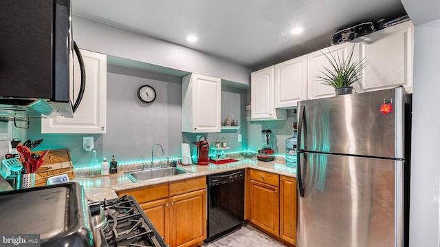 3801 Swann Rd Unit 101, Suitland, MD 20746 - kitchen featuring freestanding refrigerator, dishwasher, a sink, white cabinetry, and gas stove
