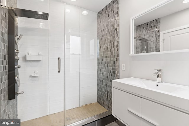 full bath featuring a shower stall and vanity