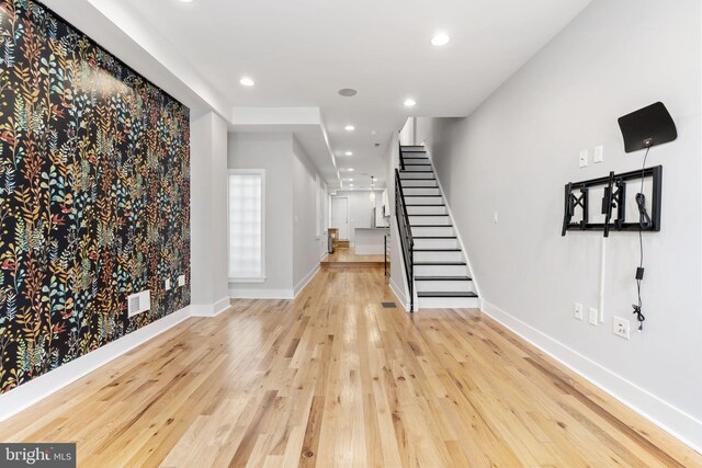 entrance foyer featuring baseboards, visible vents, recessed lighting, stairway, and hardwood / wood-style flooring