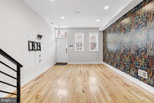 entrance foyer with baseboards, visible vents, recessed lighting, wood finished floors, and stairs