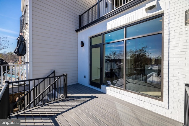entrance to property with a balcony
