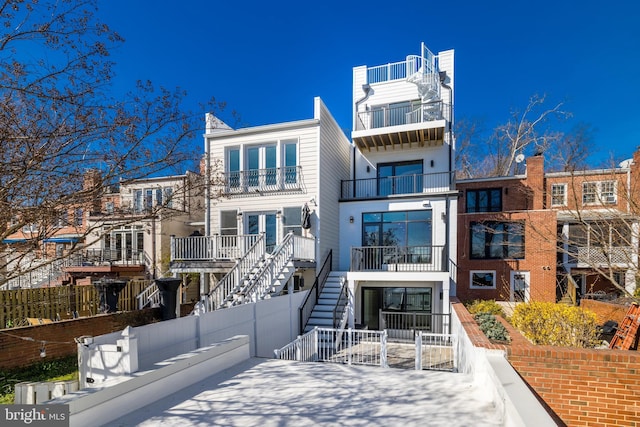 exterior space featuring stairway and fence