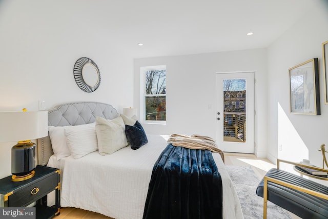 bedroom featuring recessed lighting, wood finished floors, access to exterior, and baseboards