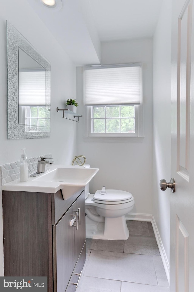 4011 Hummer Rd, Annandale, VA 22003 - bathroom with toilet, vanity, and baseboards