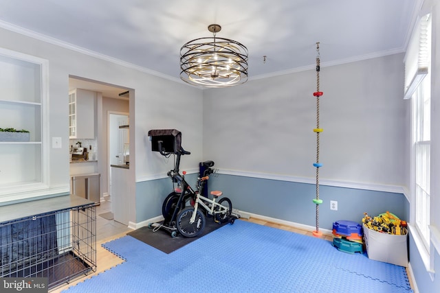 4011 Hummer Rd, Annandale, VA 22003 - exercise area with a chandelier, built in features, ornamental molding, light wood-style floors, and baseboards