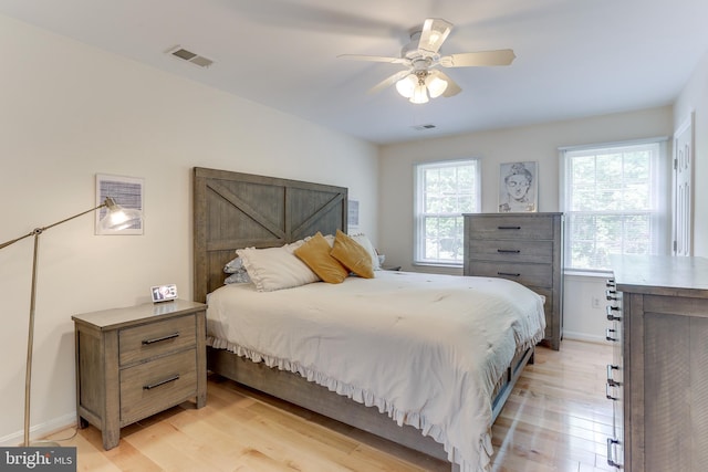 4011 Hummer Rd, Annandale, VA 22003 - bedroom with light wood finished floors, a ceiling fan, and baseboards