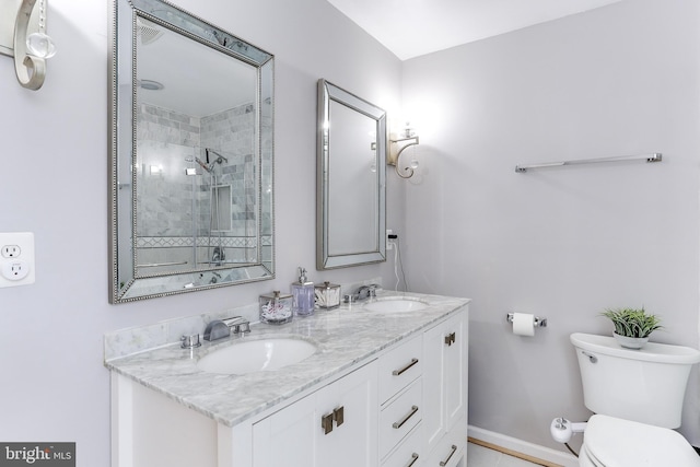 4011 Hummer Rd, Annandale, VA 22003 - full bathroom with toilet, a tile shower, baseboards, and double vanity