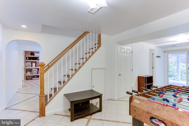 4011 Hummer Rd, Annandale, VA 22003 - playroom featuring light tile patterned floors, baseboards, arched walkways, and recessed lighting