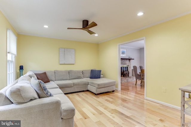 4011 Hummer Rd, Annandale, VA 22003 - living room with a ceiling fan, light wood-style flooring, recessed lighting, crown molding, and a brick fireplace