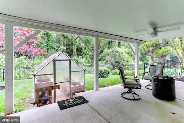 4011 Hummer Rd, Annandale, VA 22003 - view of patio featuring ceiling fan, a greenhouse, and an outbuilding
