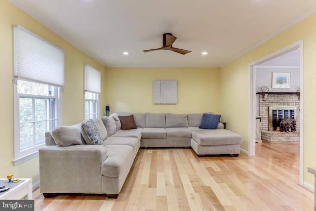 4011 Hummer Rd, Annandale, VA 22003 - living area featuring light wood-style floors, a ceiling fan, crown molding, recessed lighting, and a brick fireplace