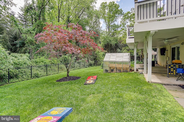 4011 Hummer Rd, Annandale, VA 22003 - view of yard with an exterior structure, a balcony, a ceiling fan, an outdoor structure, and a patio area
