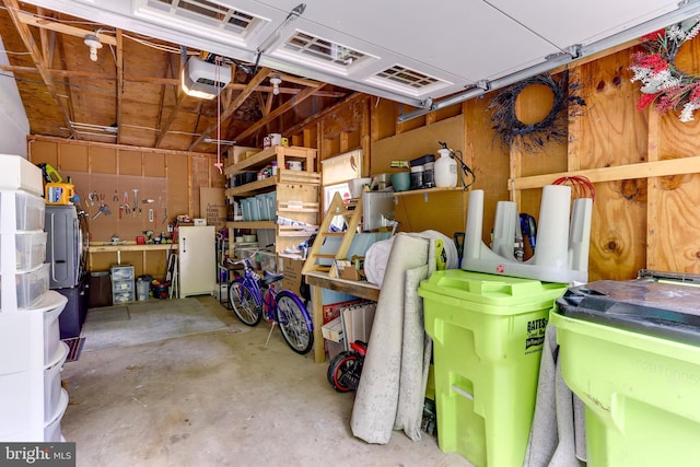 4011 Hummer Rd, Annandale, VA 22003 - garage featuring a garage door opener and a workshop area