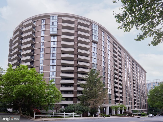 view of building exterior with fence