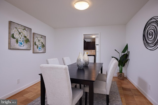 dining space featuring baseboards