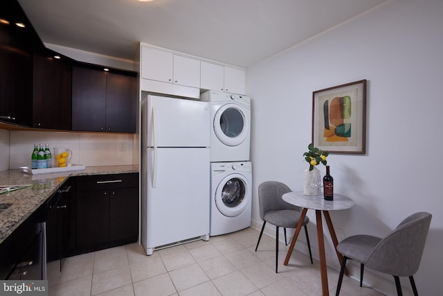 laundry area featuring laundry area and stacked washer and dryer
