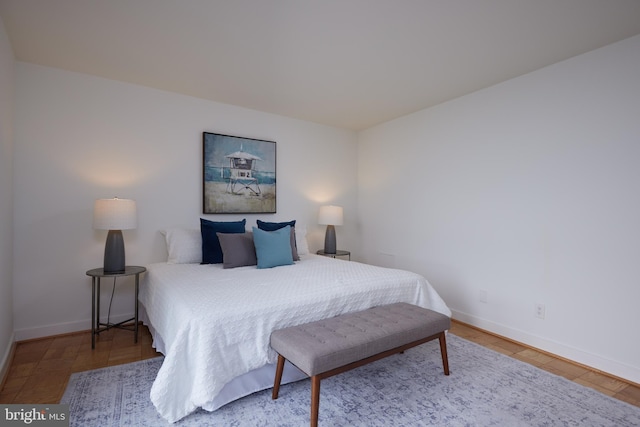 bedroom featuring baseboards