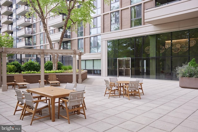 view of patio featuring outdoor dining area