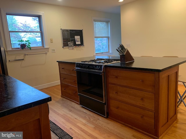 3903 8th St S, Arlington, VA 22204 - kitchen with gas range oven, light wood-style flooring, plenty of natural light, and recessed lighting