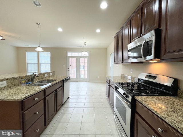 3648 Holborn Pl Unit 3648, Frederick, MD 21704 - kitchen featuring dark brown cabinets, a sink, light tile patterned floors, appliances with stainless steel finishes, and recessed lighting