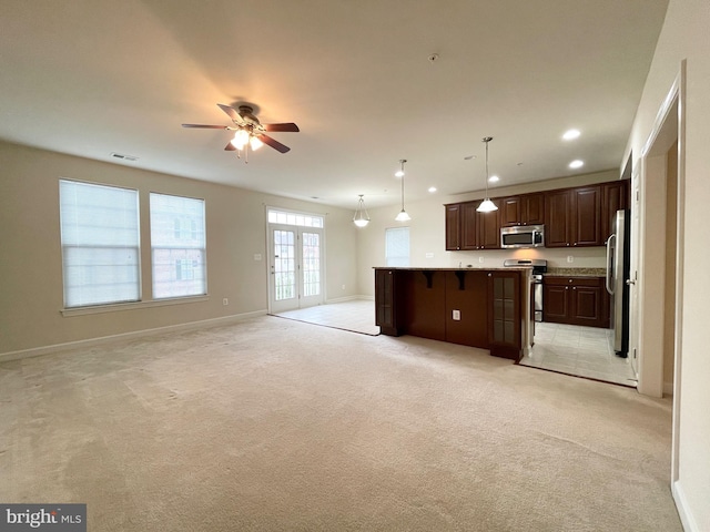 3648 Holborn Pl Unit 3648, Frederick, MD 21704 - kitchen featuring open floor plan, visible vents, a ceiling fan, a kitchen island, and appliances with stainless steel finishes