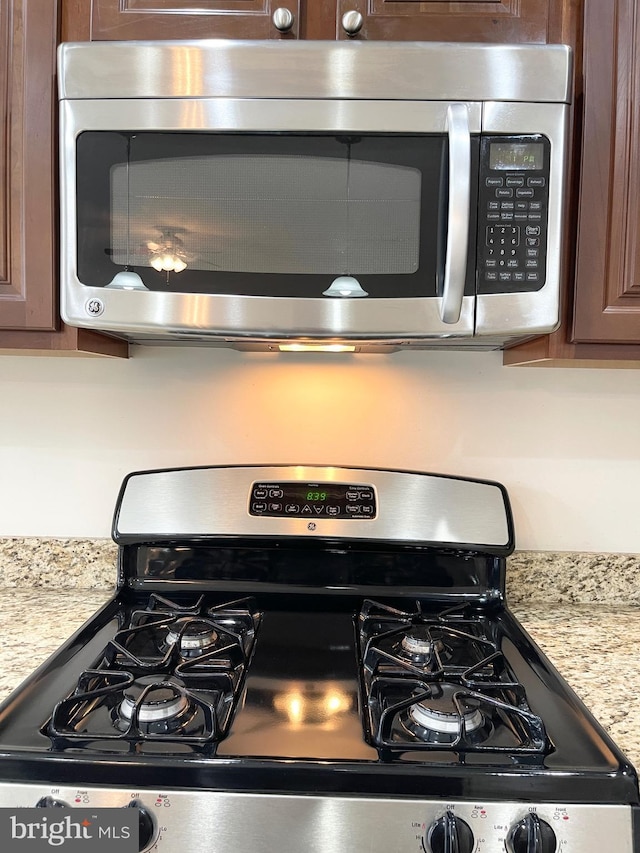 3648 Holborn Pl Unit 3648, Frederick, MD 21704 - room details with appliances with stainless steel finishes and dark brown cabinets