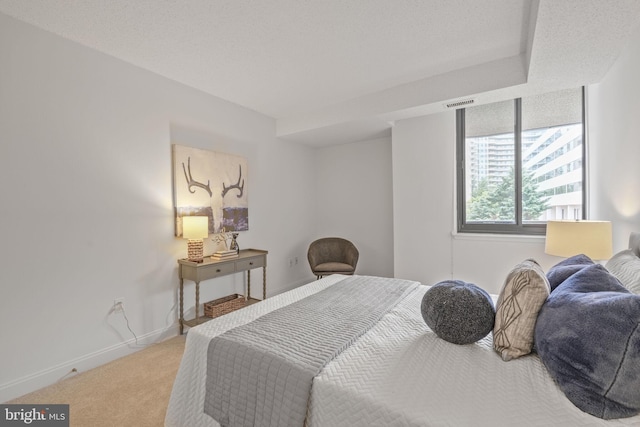 carpeted bedroom with baseboards