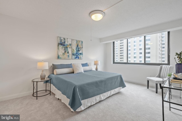 bedroom featuring carpet floors and baseboards