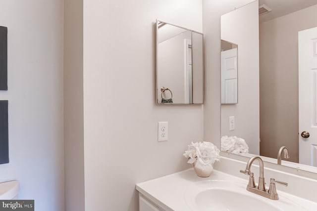 bathroom featuring visible vents and vanity