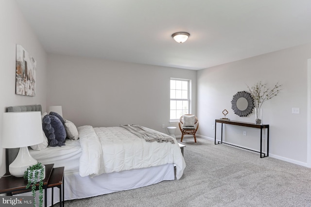 bedroom featuring baseboards and carpet floors