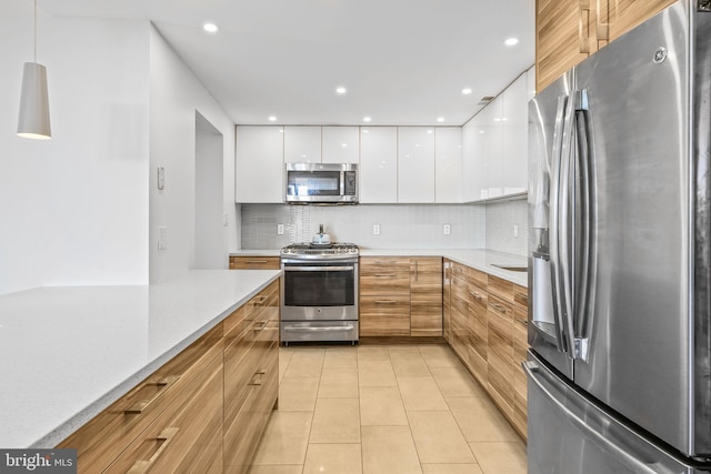 4620 N Park Ave Unit 1508E, Chevy Chase, MD 20815 - kitchen with appliances with stainless steel finishes, modern cabinets, white cabinets, backsplash, and light countertops