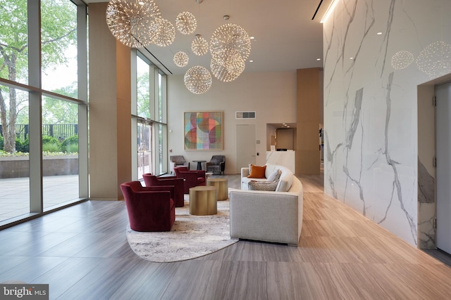 4620 N Park Ave Unit 1508E, Chevy Chase, MD 20815 - common area with a towering ceiling and expansive windows