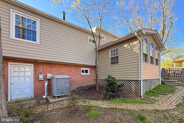 4500 Hadrian Ct, Alexandria, VA 22310 - rear view of property featuring central AC and brick siding