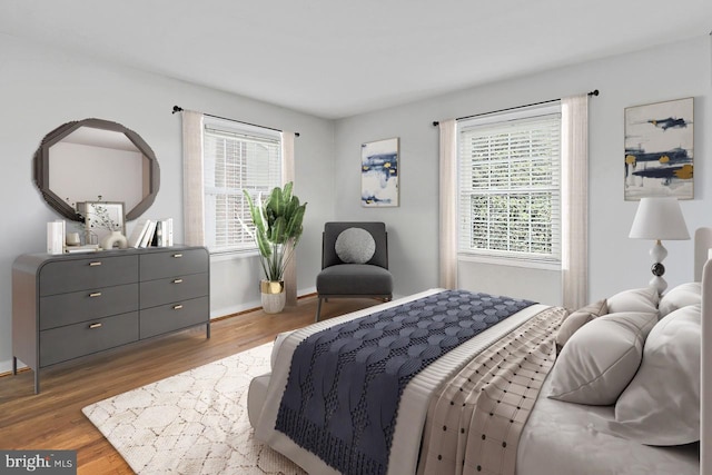 4500 Hadrian Ct, Alexandria, VA 22310 - bedroom featuring multiple windows, wood finished floors, and baseboards