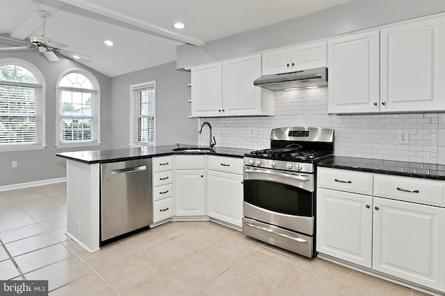 4500 Hadrian Ct, Alexandria, VA 22310 - kitchen featuring stainless steel appliances, a sink, under cabinet range hood, a peninsula, and white cabinets